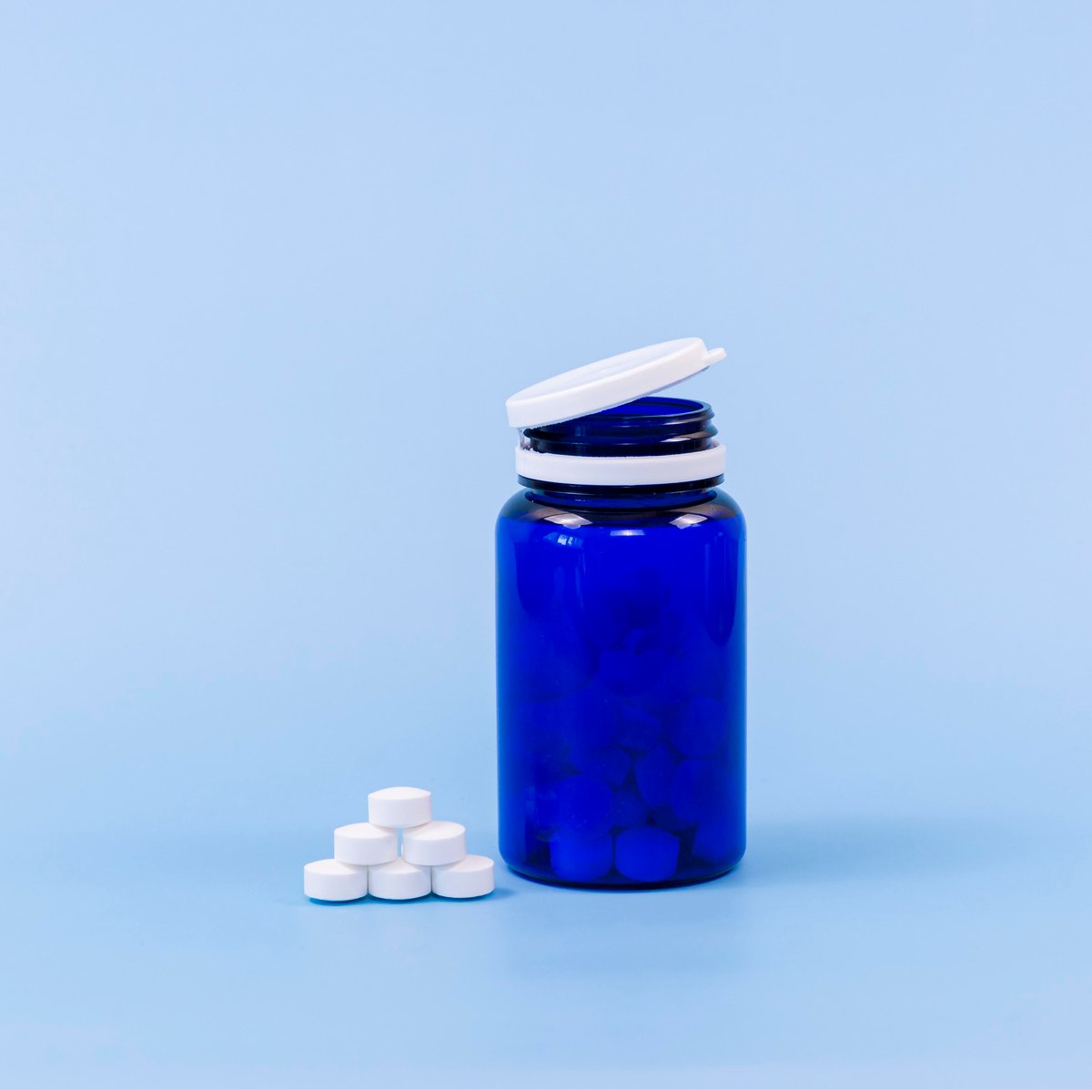 high-angle-pills-plastic-container-with-copy-space